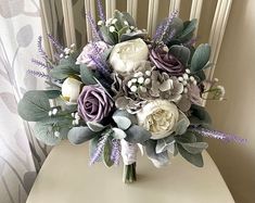 a bouquet of flowers sitting on top of a white chair