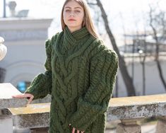 "MATERIAL : 2 strands of 100 % soft wool COLOUR : Green ( There may be a slight difference because of the different monitors' representation) ♥ In the picture the model is wearing a garment with these measurements : A: ( Body lenght) : 28.3 \" / 72 cm B: ( Chest width) : 21.3 \" / 54 cm C: (Sleeve from under the arm) : 22.8 \" / 58 cm D: (Neck unrolled) : 3.5 \" / 9 cm. They are taken with the item laid flat and not streched. ♥ For choosing your size please look at size chart in our listing pict Cozy Green Cable Knit Sweater, Green Cable Knit Turtleneck Sweater, Green Wool Cable Knit Sweater, Green Cotton Cable Knit Sweater, Green V-neck Cable Knit Sweater, Green Cable Knit Sweater, Green Knit Sweater, Mohair Jumpers, Woolen Sweater