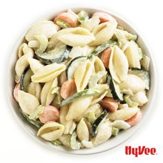 a white bowl filled with pasta and vegetables