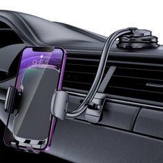 an image of a cell phone in the car with a charger attached to it