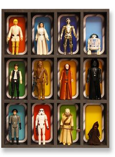 star wars action figures are displayed in a box with different colors and sizes on them