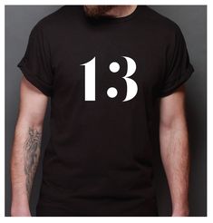 Number 13 Tshirt Made of 50/50 cotton/poly supersoft quality t-shirt Also available in any 2-digit # Black Graphic Tee With Number Print, Numbers Design, Number 13, Quality T Shirts, Cool Shirts, Favorite Outfit, Gender Neutral, Graphic Tees, Adult Outfits