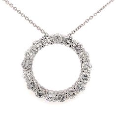 This is our magnificent Circle of Love pendant necklace in 14 kt white gold! This classic circle pendant has an amazing 7.00 ct. total weight of immaculately clean SI-1 clarity and brilliantly white F color diamonds set in a never ending circle on this pendant. A 16 inch cable link chain loops through the hidden bale of the pendant and this secures to the neck with a lobster claw closure. Round Cut Halo Diamond Necklace For Anniversary, Anniversary Round Cut Halo Diamond Necklace, Anniversary Halo Diamond Necklace With Round Cut, Round Diamond Cut Necklace, Classic Round Diamond Necklace With Halo Design, White Halo Diamond Necklace, White Round Halo Diamond Necklace, White Gold Full Circle Necklace For Anniversary, White Gold Circle Necklace For Anniversary