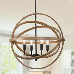 a wooden orb chandelier hanging from a ceiling