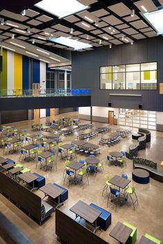 an empty classroom with tables and chairs in it