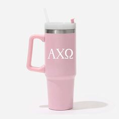 a pink travel mug with the word axq on it and a straw sticking out