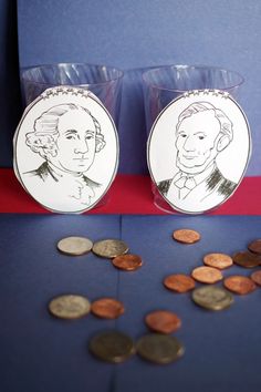 two cups filled with coins sitting on top of a table