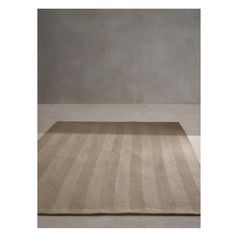 a beige rug with vertical stripes on the floor