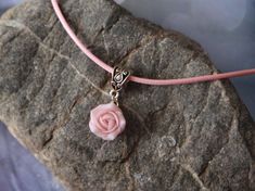 "Light pink necklace with sculpted powder pink rose. Material of rose is polymer clay. Each petal of flower made by hand Dia flower about 15 mm/ 0.55 \" Length of necklace is adjustable: 10-12 inches/ 25,4 - 30,5 cm 11-13 inches/ 28-33 cm 12-14 inches/ 30.5- 35.5 cm 13-15 inches/ 33-38 cm 14-16 inches/ 35.5 cm-40.5 cm 15-17 inches/ 38,1 cm- 43,2 cm 16-18 inches/ 40.6 cm- 45.7 cm 17-19 inches/ 43 cm - 48 cm 18-20 inches/ 45,5- 50.8 cm If you need other length of necklace let me know and I will ma Handmade Pink Choker As Gift, Handmade Pink Choker As A Gift, Pink Charm Choker Necklace For Gift, Adjustable Pink Pendant Charm Necklaces, Pink Rose Design Pendant Necklace, Pink Flower Charm Necklace With Flower Pendant, Adjustable Pink Pendant Jewelry, Pink Flower Jewelry With Rose Design, Delicate Pink Pendant Flower Necklace