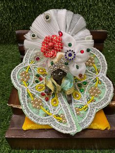 an elaborately decorated bench in the grass