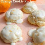 orange cookie recipe with white icing on pink paper