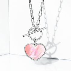 Ross-Simons - Italian Pink Mother-of-Pearl Heart Toggle Necklace in Silver. 18". This fresh pick comes for a nice price. Made in Italy, our charming toggle necklace shines with a 12x11mm heart-shaped pink mother-of-pearl slice set in sterling silver. Suspends from a cable chain. Pink mother-of-pearl heart toggle necklace. Pearl birthstones are the perfect gift for June birthdays. Trendy Necklaces With Toggle Clasp For Valentine's Day, Trendy Valentine's Day Necklace With Toggle Clasp, Silver Toggle Necklace With Pearl Pendant, Elegant Metal Toggle Necklace For Valentine's Day, Silver Toggle Necklace With Pearl Charm Gift, Silver Toggle Necklace With Pearl Pendant As Gift, Valentine's Day Metal Toggle Necklace With Heart Charm, Metal Toggle Necklace For Valentine's Day Gift, Valentine's Day Jewelry With Toggle Clasp