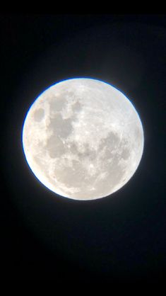 the full moon is seen in the dark sky