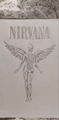 a drawing of a woman with wings and the word nirvana on it's back