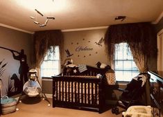 a baby's room decorated in black and white