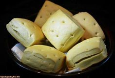 several pieces of cheese sitting in a bowl