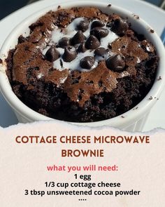 a brownie in a white bowl with chocolate chips and cream on top that is labeled cottage cheese microwave brownie, what you will need 1 egg 13 cup cottage cheese cheese