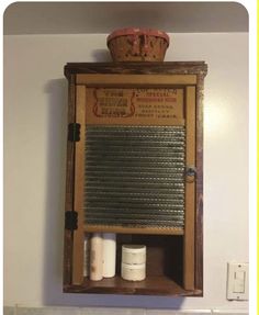 an old fashioned wooden medicine cabinet with two jars