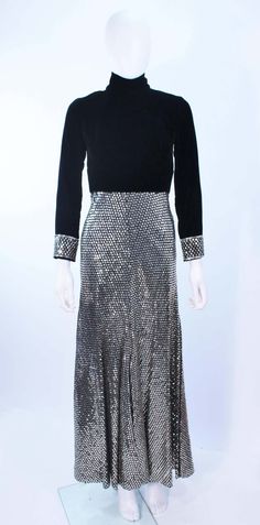 For Sale on 1stDibs - This vintage gown is composed of black velvet and features sequin accents. There is a center back zipper closure with button details, and a mockneck. In Velvet Sequin Dress For Gala, Formal Fitted Velvet Dress With Sequins, Formal Fitted Velvet Sequin Dress, Sequined Velvet Evening Dress, Vintage Gowns, Sequin Gown, Silver Sequin, Black Velvet, Mock Neck