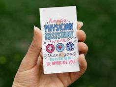 a person holding up a card with the words happy physical assistant week written on it