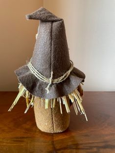 a brown hat sitting on top of a wooden table