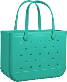 a green tote bag with holes on the side and handles, in front of a white background