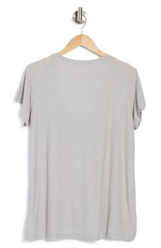 A deep curved V-neck shows a bit of skin on a slubbed and elevated cotton-and-modal blend T-shirt you'll want in every color. 26" length (size 2) V-neck Short sleeves 51% cotton, 49% modal Machine wash, tumble dry Imported Model stats: 5'10", 32" bust, 25" waist, 36" hip. Model is wearing size 2. Everyday V-neck Short Sleeve Top For Summer, V-neck Short Sleeve Top For Summer, Solid V-neck Tops In Modal, Relaxed Fit Modal Top With Short Sleeves, V-neck T-shirt For Summer Layering, Solid Summer T-shirt With Shirttail Hem, Summer V-neck T-shirt For Layering, Soft-washed T-shirt For Layering In Summer, Soft-washed V-neck T-shirt For Summer