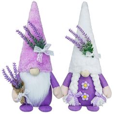 two purple and white gnomes with flowers on their heads, one holding a plant