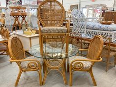 wicker chairs and tables are on display at a furniture store