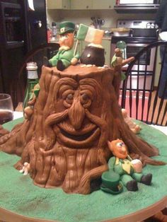 a cake made to look like a tree stump with an image of a man on it