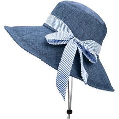 a blue and white hat with a bow on it