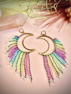 Reqdy to ship hand woven beaded shoulder duster fringe earrings that give all the Boho vibes! This beautiful set is created with vibrant colored seed beads that bring all the energy Please note in the comments if you need clip on ear posts The earwires are either raw brass or  hypo-allergenic Niobium, are nickel-free and lead-free. Bohemian Rainbow Beaded Earrings With Fringe, Bohemian Rainbow Beaded Earrings For Summer, Bohemian Rainbow Beaded Earrings For Beach, Bohemian Rainbow Tassel Earrings, Light Fringe, Bead Tutorials, Moon Light, Beading Tutorials, Fringe Earrings