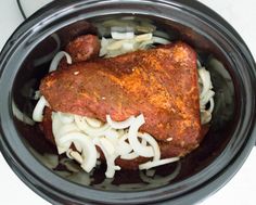 the meat is cooked and ready to be served in the crock pot with onions