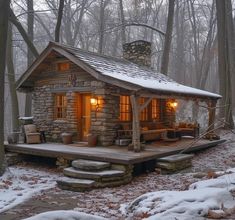 a small log cabin in the woods with snow on the ground and trees around it