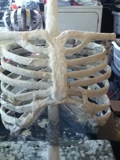 a skeleton sitting on top of a table