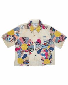 a white shirt with colorful patches on it