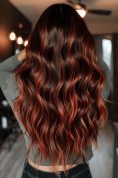 Check out our collection of over 30 trendy brown hair & red highlights ideas that are sure to inspire your next look. From the vibrant ginger balayage on brown hair you see here to subtle burgundy highlights, our article shares a variety of stylish ways to incorporate red highlights into dark bases. Click the pin to see all the ideas now or save it for inspiration later! Red Brown Hair With Copper Highlights, Red To Brown Balayage, Dark Brown Bayalage With Red, Brunette To Red Balayage, Red And Blonde Highlights On Black Hair, Highlights Brown Hair With Red, Red Tints In Brown Hair, Fall Hair Colors Brunette With Red, Dark Brown To Red Balayage