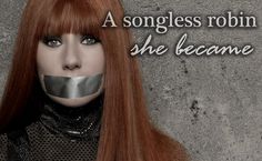 a woman with long red hair has duct tape on her face