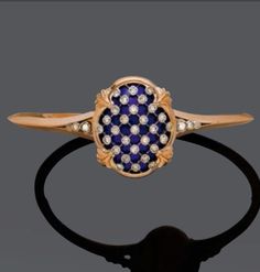 Enamel, diamond and gold bangle, circa 1880. The blue enamelled central element decorated with a trellis motif set with diamonds, mounted in gold.  #antique #Victorian #bangle Latest Jewellery Trends, Sparkly Jewelry, Trendy Necklaces, Diamonds And Gold, Gold Bangle, Put A Ring On It, Bling Rings, Diamond Bangle, Classic Jewelry