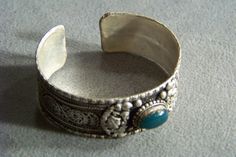 I am offering you this wonderful vintage and ornate silver plated bangle cuff style bracelet with genuine large oval shaped genuine green agate stones. These are cabochon stones, and they are bezel set , with gorgeous ornate thick braiding and raised relief bead and decorating around them. It is done in a fabulous ornate bold thick raised relief styled scrolled and beaded bangle cuff bracelet. This is a very unique design, having so many ornate elements to it, with of very thick and heavy cuff / Bohemian Oval Gemstone Cuff Bracelet, Bohemian Silver Oval Cuff Bracelet, Cuff Bangle Bracelet, Rochester Ny, Green Agate, Cuff Bangles, Agate Stone, Bangle Bracelet, Fashion Bracelets