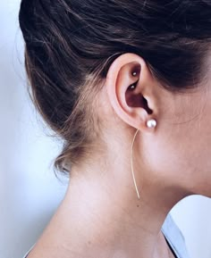 a woman with ear piercings on her ears