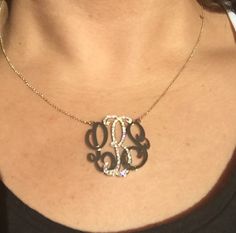 "A very special version of our medium (1.25\") monogram necklace! In this absolutely stunning necklace, the center initial is covered with beautiful F-G color, VS1-VS2 clarity diamonds. The total carat weight and count of the diamonds will vary slightly depending on which letter the center initial is. The H in the necklace pictured is covered in 82 diamonds with a weight of 0.50 ct. Also, the 14k gold plate is significantly thicker and heavier than the plate used for our traditional monograms. T Elegant Diamond Monogram Initial Necklace, Luxury Monogram Initial Necklace, Elegant Diamond Monogram Jewelry, Elegant Black Necklace For Personalized Gift, Silver Luxury Initial Necklace With Monogram, Elegant Black Monogram Jewelry, Gold Monogram Necklace, Monogram Necklace Gold, Necklace With Diamond