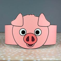 a pink pig headband with big eyes