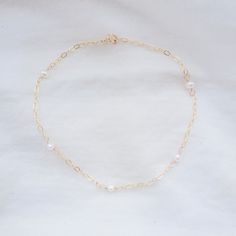 Our bestselling Pearl Satellite design, now in anklet form! This dainty piece adds a delicate touch, perfect for summer. Made with a sturdier chain for daily wear and tear, and adjustable to any length. Select the maximum length you wish to adjust to. Freshwater pearls are natural gemstones, so each is unique and no two will be exactly alike. The pearls selected for your piece will be similar to those pictured. Satellite Design, Anklets, Fresh Water, Freshwater Pearls, Daily Wear, Natural Gemstones, Gold Filled, Gold Necklace, Gemstones