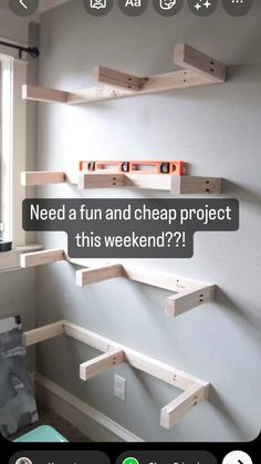 three wooden shelves on the wall above a baby's crib in a nursery