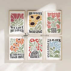 four framed art prints with flowers and words on the front, one is saying'we love