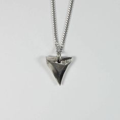 Silver Shark Tooth Pendant in Sterling SIlver Handmade Sterling Silver Arrowhead Necklace, Sterling Silver Brutalist Necklace For Gift, Silver Triangle Jewelry For Everyday, Rustic Nickel-free Silver Necklace, Engraved Sterling Silver Brutalist Jewelry, Nickel-free Triangle Sterling Silver Jewelry, Silver Sterling Silver Arrowhead Necklace, Handmade Sterling Silver Triangle Jewelry, Unique Triangle Sterling Silver Jewelry