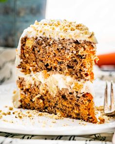 a slice of carrot cake on a plate with a fork