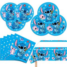 a bunch of blue paper plates and napkins with cartoon characters on them, including an elephant