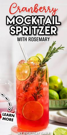 a drink in a glass with lemons and rosemary garnish